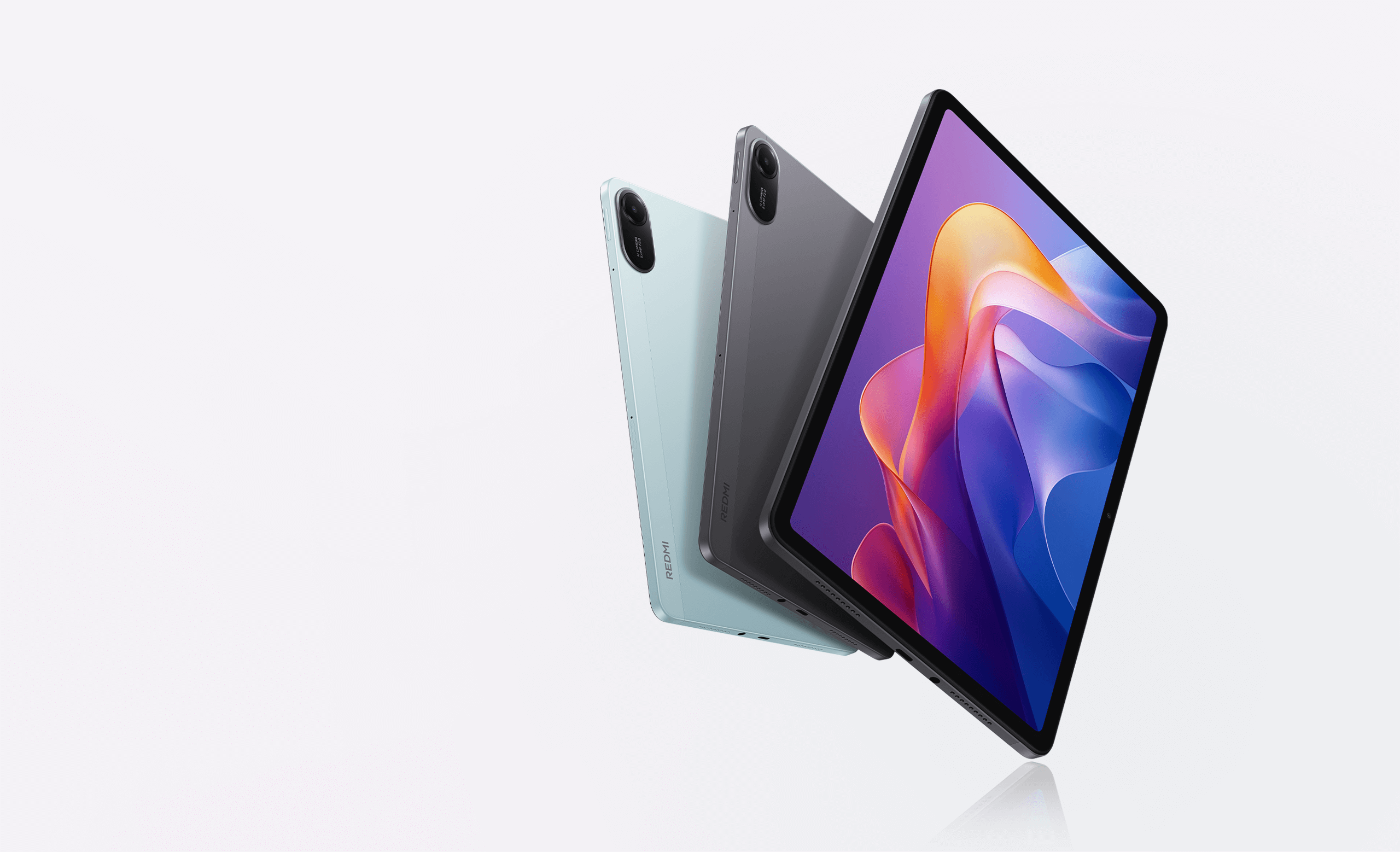 Xiaomi Redmi Pad 2 series tablet in graphite gray and mint green with the screen visible
